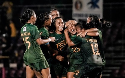 <p><strong>WINNING GOAL</strong>. Marinelle Cristobal (No. 23) celebrates with her teammates after lifting Far Eastern University to a 1-0 win over University of Santo Tomas in the UAAP Season 87 women's football tournament at UP Diliman Football Stadium in Quezon City on Saturday (Oct. 19, 2024). She scored in the 75th minute.<em> (UAAP photo)</em></p>