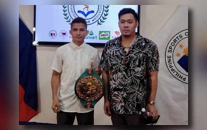 <p><strong>PSA ACHIEVER. </strong>World Boxing Council mini-flyweight champion Melvin Jerusalem (left) with Sanman Promotions CEO JC Mananquil during the Philippine Sportswriters Association (PSA) Forum at the Rizal Memorial Sports Complex on April 2, 2024. Jerusalem led the PSA Monthly Achievers for March. <em>(Contributed photo) </em></p>