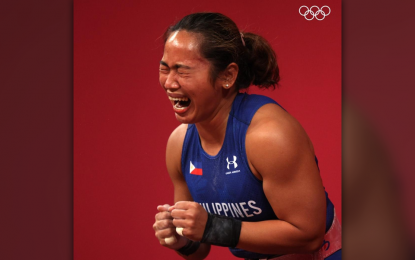 <p><strong>TEARS OF JOY.</strong> Filipino weightlifter Hidilyn Diaz reacts after winning the gold medal at the 2020 Tokyo Olympics. She will be enshrined in the Hall of Fame during the PSA Awards ceremony at the Manila Hotel grand ballroom on Jan. 27, 2025. <em>(Contributed photo)</em></p>