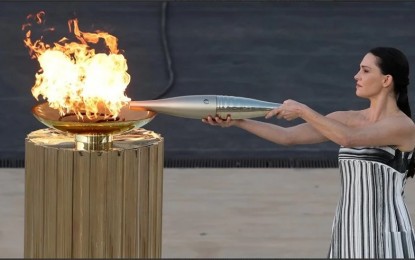 <p><strong>TORCHBEARER. </strong> Greece hands the Olympic flame to Paris 2024 organizers in a ceremony on Friday (April 26, 2024) in the Panathenaic stadium in central Athens. It is expected to arrive in Paris on May 8 and will be received by the first torchbearer, French swimmer Florent Manaudou. <em>(Anadolu)</em></p>