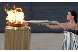 Athens hands Olympic flame to Paris 2024 organizers