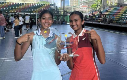 <p><strong>RISING STARS.</strong> Philippine Tennis Academy bets Arriana Reign Maglana (right) Louraine Jallorina show their trophies after winning the girls U18 doubles title in the Juntaphil Cup at the Rizal Memorial Tennis Center in Manila on Sunday (April 27, 2025). They beat Maria Isabel Ataiza and Avegail Joy Ansay, 6-1, 6-2. <em>(Contributed photo) </em></p>