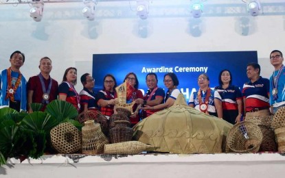 <p><strong>AWARDING</strong>. Sports officials from Iloilo province strike a pose after receiving the overall championship trophy during the Western Visayas Regional Athletic Association 2025 awarding ceremony and culmination on Friday (March 7, 2025). Antique province hosted the weeklong meet<em>. (Photo courtesy of Buenavista CatV)</em></p>