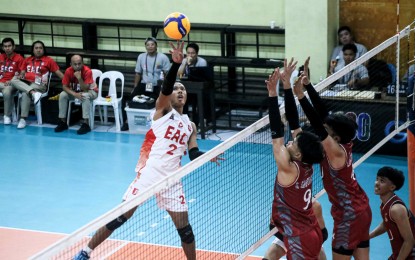 <p><strong>NCAA VOLLEYBALL.</strong> Paul Justine Say (left) of Emilio Aguinaldo College against Lyceum of the Philippines University defenders in the NCAA Season 100 men's volleyball tournament at the San Sebastian College-Recoletos gym last week. Say scored 18 points as EAC defeated San Sebastian College-Recoletos, 26-24, 25-14, 23-25, 25-18, on Friday (Feb. 28, 2025). <em>(NCAA photo)</em></p>