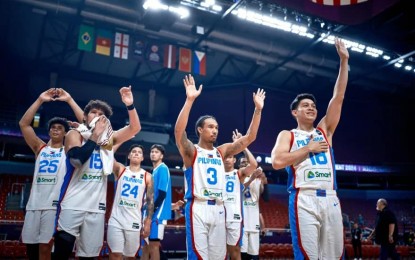 <p><strong>SEMIS BOUND.</strong> Gilas Pilipinas players wave to the crowd after losing to Georgia, 94-96, but still making the semifinals of the Olympic Qualifying tournament in Riga, Latvia on Thursday night (July 4, 2024; PH time). The Philippines advanced via superior quotient and will join the host in the crossover Final Four on Saturday (July 6). <em>(Photo courtesy of FIBA)</em></p>